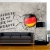 Fototapeta - Flaga Niemiec napisy pęknieta ściana